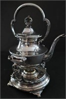 Silver tilting tea silver with heater