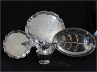 A Set of Three Silver Plate Trays And Pitcher
