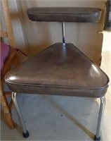 Chrome legged padded chair