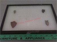 4 stone arrowheads in display