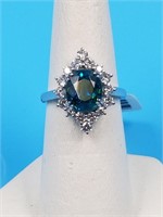 Platinum Blue Zircon & Diamond ring. The ring is m