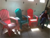 Four  plastic Adirondack chairs (some fading but