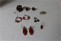 lot of red jewlery , 4 pairs of earrings , 1 charm