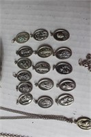 lot of christian charms with two silver chains