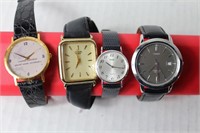 misc lot of 4 black band watches [not tested]