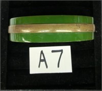 A7- green clamper Bakelite bracelet having brass