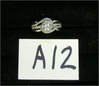 A12- sterling swirl ring w/clear stones size 6.75