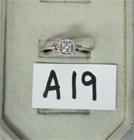 A19- sterling band w/square clear stone and