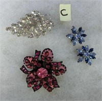 C-  4 rhinestone brooches the clear one is