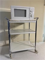 Microwave on vintage metal cart
