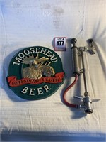 Vintage beer tapper and foam Moosehead beer sign