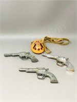 3 small cap pistols, clay whistle