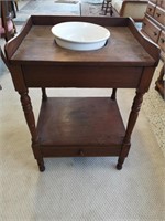 Vintage wooden washstand with drawer.