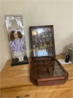 porcelain face doll and 2 display cabinets
