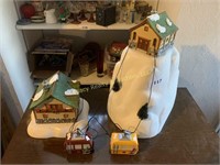 several pieces of lighted alpine village collectib