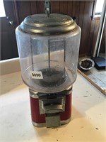 Glass gumball machine. Hole in back. Has key