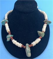 Necklace made from seashell beads and raw turquois