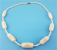 Nicely carved bone beaded necklace about 20" long