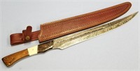 Damascus bladed short sword with brass, wood, and