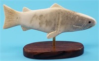 Moose antler carving of a salmon on a wood base ab