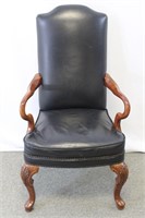 Black leather and wood arm chair