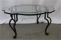 Glass topped iron coffee table