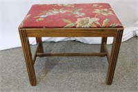 Small upholstered wooden bench
