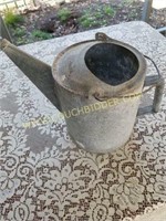 Antique galvanized watering pot