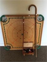 Carrom board and walking stick and cane
