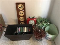 Clock, home decor, VHS tapes, wooden basket