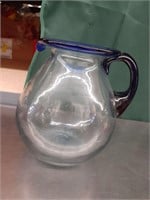 Blue rimmed glass pitcher