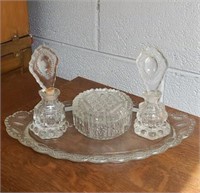 Vanity set with powder puff and perfume bottles