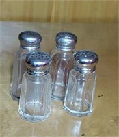 Group of 4 salt and pepper shakers
