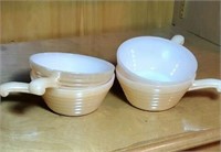 Group of  4 peach luster Fire King bowls