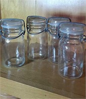 Group of 4 Wheaton jars with glass lids