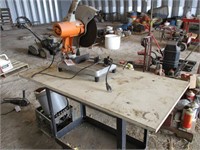 TABLE SAW W/ VISE ON TABLE W/ WHEELS