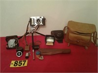 Ricoh camera w/ tripod,lens, case, & more