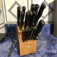 Set of kitchen knives with wooden holder