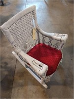 Child's wicker rocking chair with padded seat
