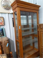 Tall lighted glass curio with glass shelves