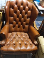 Rust colored wingback chair