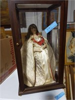 Porcelain doll in a display case