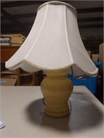 Small yellow table lamp with white shade