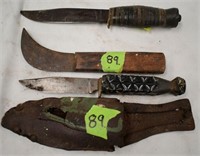 Two sheath knives and another