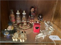 Shelf of Assorted Dolls