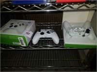 Two damaged Xbox controllers one has a bad toggle