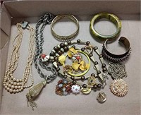 Necklaces, cuffs, clip-on earrings, pins