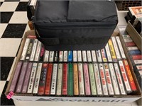 BOX OF CASSETTE TAPES AND CARRIER