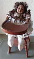 911 - COLLECTOR BABY DOLL IN HIGH CHAIR