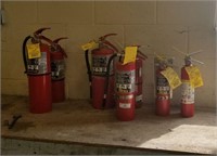 Seven Fire Extinguishers